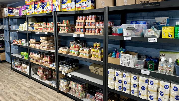 Pantry shelves stocked for weekly food distribution.